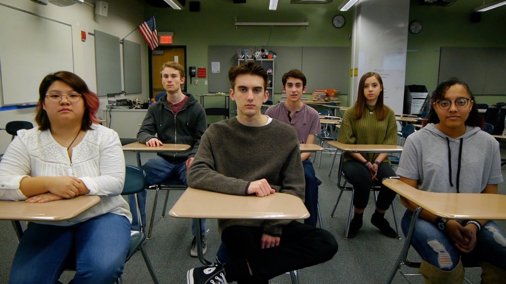 Students sitting at desks in a classroom.