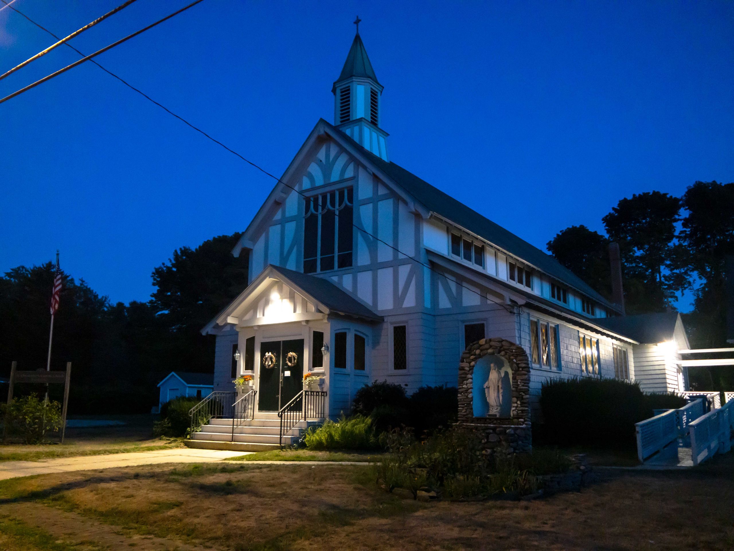 A church lit up at night.