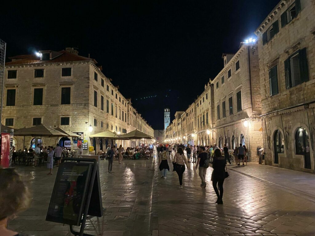 Night street scene of a cobblestone street in Dubrovnik.