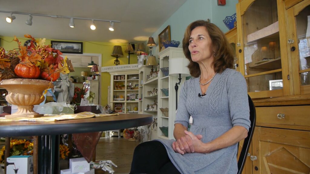 Woman sitting in a country general store.