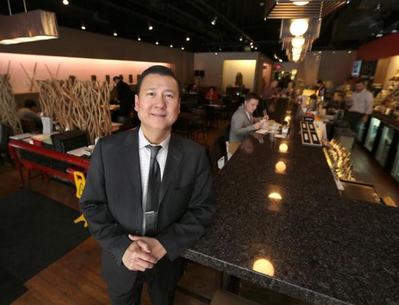 Doug Tran, owner of All Seasons Table in Malden Square.